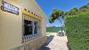 Experience the charm of traditional Spanish architecture in this retreat, featuring a pool and outdoor seating area.