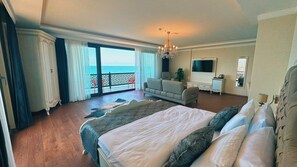 Family Room, Non Smoking, Sea View | Living area | 82-cm plasma TV with satellite channels, DVD player, heated floors - BİLİRİS HOTEL (Akçaabat)