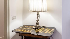 A lamp with a checkered table base.