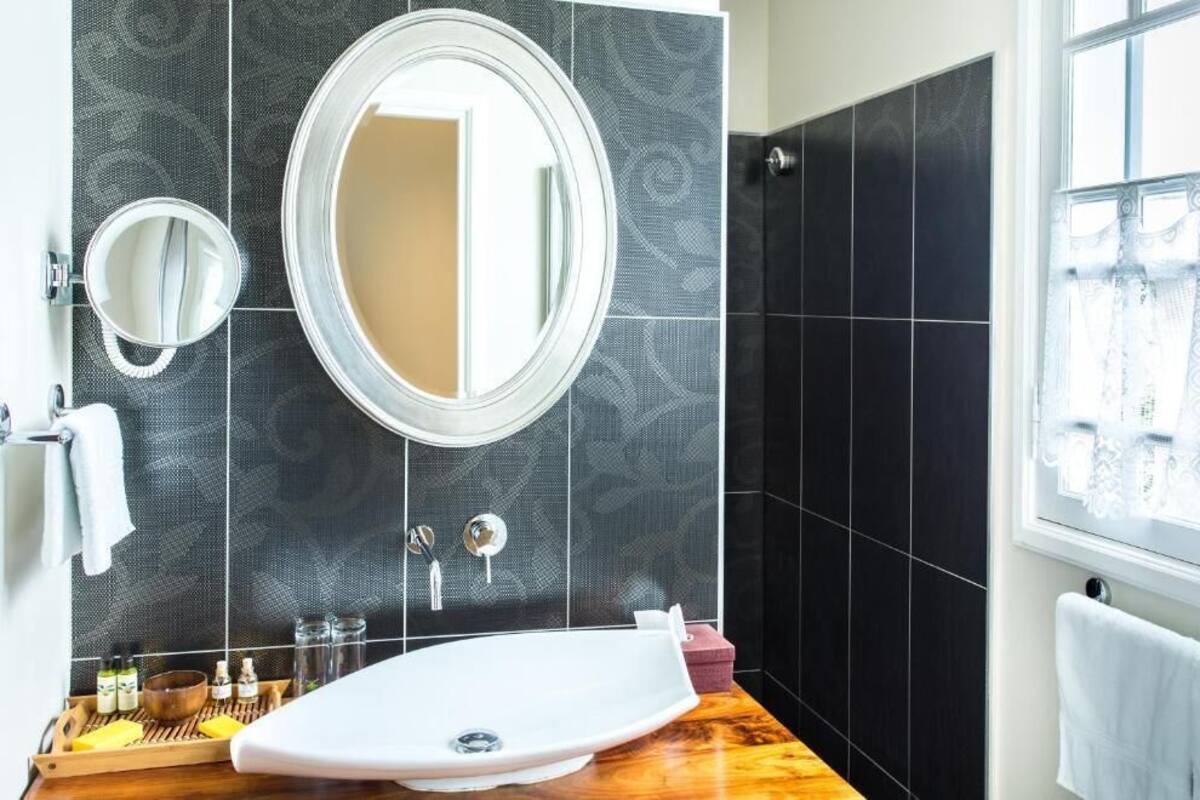deluxe double room | bathroom | shower, rainfall showerhead, free toiletries, dressing gowns