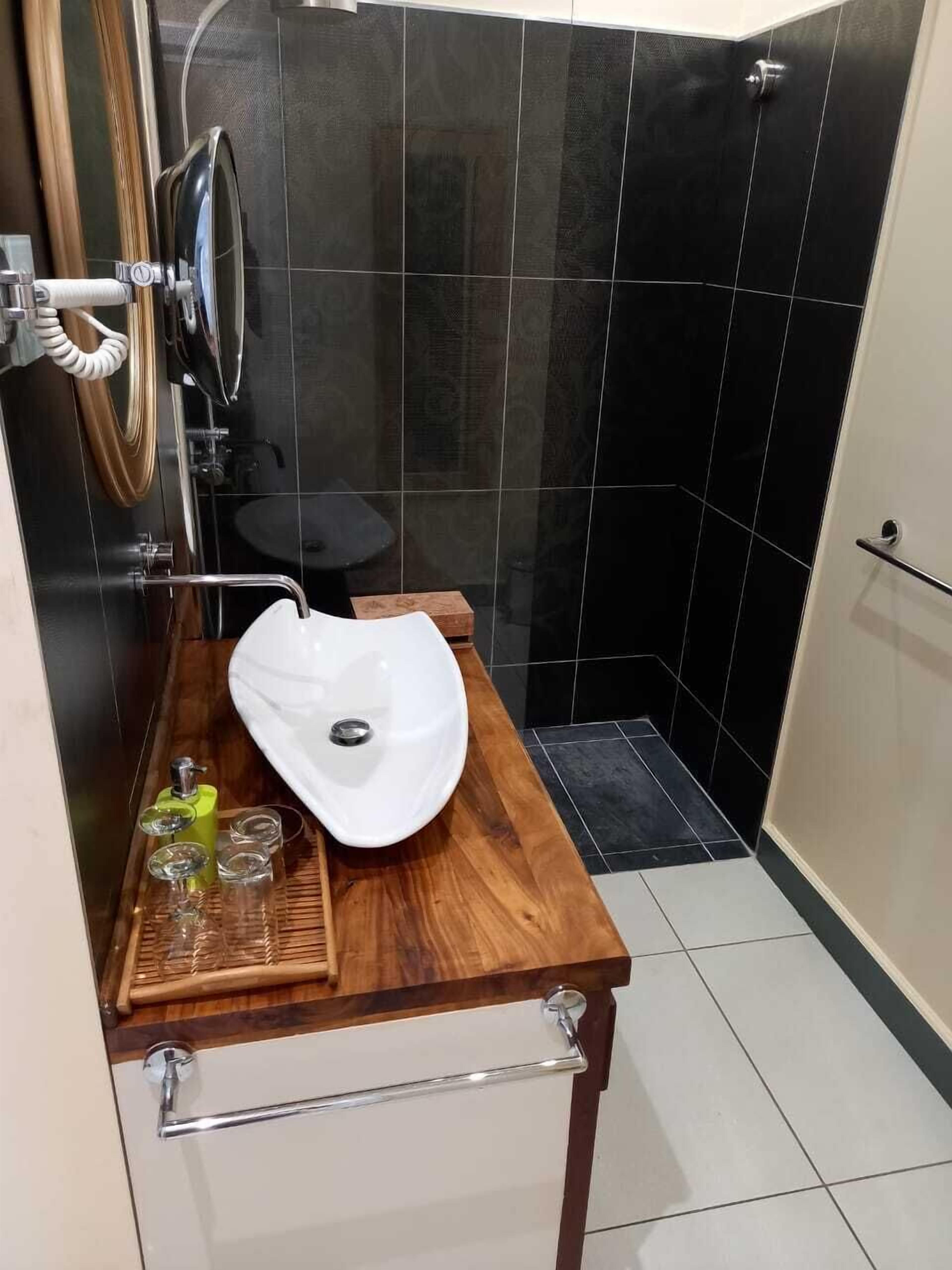 deluxe double room | bathroom | shower, rainfall showerhead, free toiletries, dressing gowns