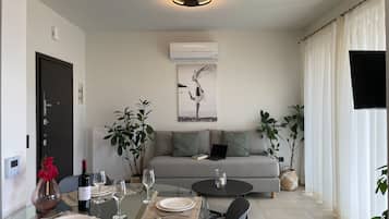 Apartamento conforto | Área de estar | Smart TV