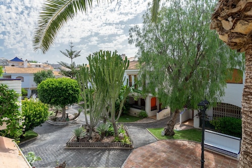 Ferienhaus 'Casa en la Playa con Piscinas V' mit Gemeinschaftspool und Klimaanlage