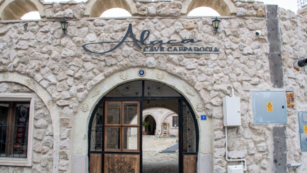 A stone building with a sign reading "Alaca Cave Carpathia". - ALACA CAVE CAPPADOCIA (Nevsehir)