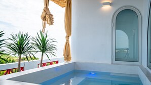 A modern indoor swimming pool with clear blue water, surrounded by white walls and red railings. - Happiness Hotel (Quy Nhon Dong)