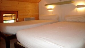 A room with two beds, wooden walls, and a window with a view. - Ski-in/Ski-out, Sleeps 6, 3 Rooms, Balcony, Parking, Crest-Voland (Crest-Voland)