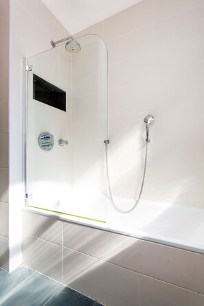 Bathtub, hair dryer, towels