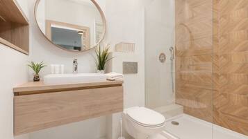 Shower, hair dryer, towels, shampoo