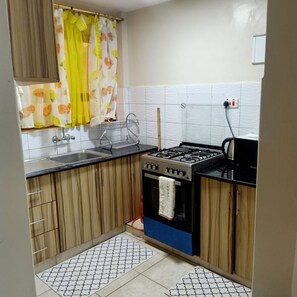 Apartment | Private kitchen | Fridge, electric kettle, cookware/dishes/utensils - Affordable Heaven by CHH (Nairobi)