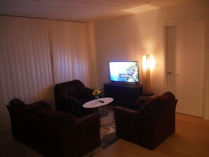 Apartamento, 1 cama Queen | Área de estar