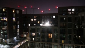 A multi-story building with illuminated windows at night, suggesting residential or hotel use. - Stunning 1-bed Apartment in London (London)