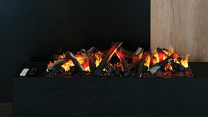 A fireplace with a modern design, a painting of a coastal landscape, and a wooden panel on the wall. - Aspen Prime Ski & Bike Resort (Podlesie)