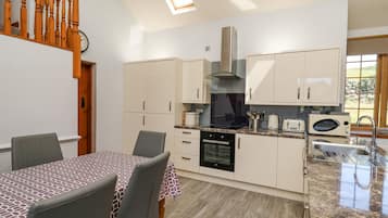 Fridge, dishwasher, electric kettle, cookware/dishes/utensils