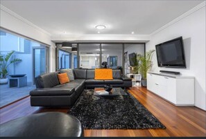 Basic House, Multiple Beds | Living area | TV