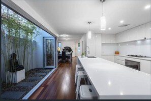 Basic House, Multiple Beds | Private kitchen | Fridge, microwave, oven, stovetop