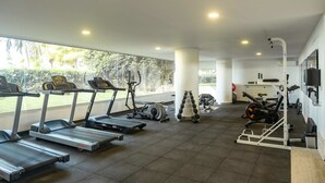 A gym with treadmills, elliptical machines, and weight equipment. - w* | Luxury 4BR w/ Private Pool in Morros Epic (Cartagena de Indias)