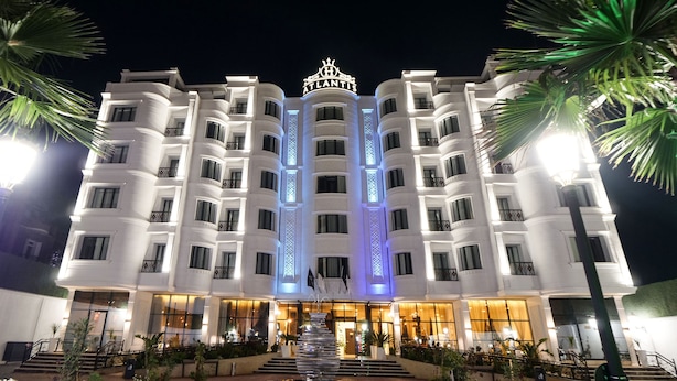 A multi-story hotel with a prominent 'Atlantis' sign at the top.