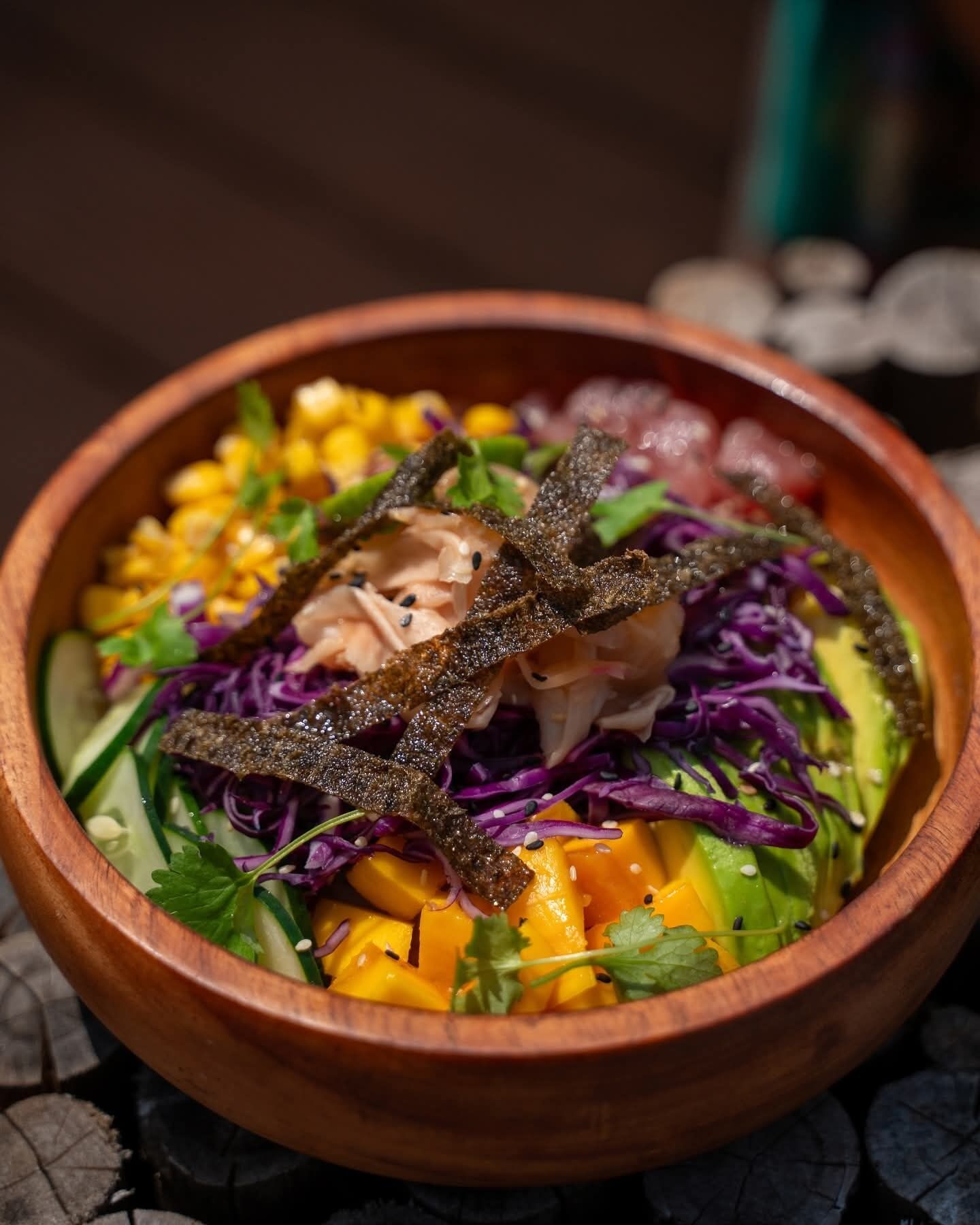 A bowl of food with various ingredients.