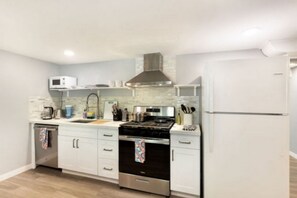 Enjoy cooking in this well-equipped kitchen with a range, microwave, and double oven.
