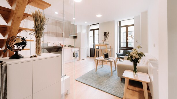 A modern living space with a kitchen, dining area, and seating area. - San Bernardo 19 (Aviles)