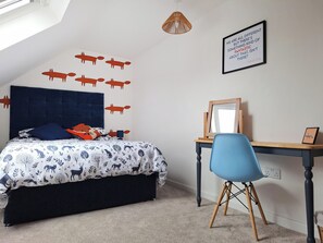 A bedroom with a bed, a desk, a chair, a wall decal of animals, a pendant light, and a motivational quote on the wall. - No. 1 Fox Burrow-UK44306 (Great Witchingham)