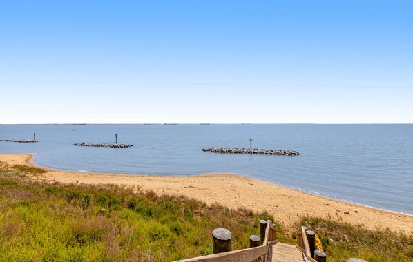 Enjoy a tranquil beach experience with access to the ocean and scenic views.