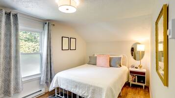 1 bedroom, desk, iron/ironing board, travel crib