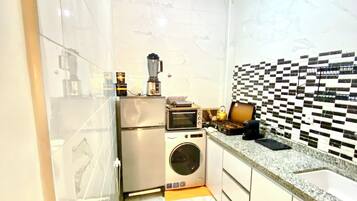 Mini-fridge, stovetop, electric kettle, toaster