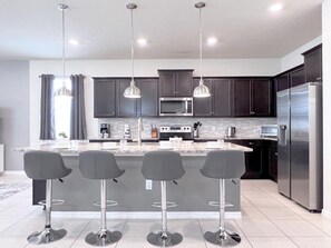 Fridge, microwave, oven, stovetop - Luxury & Loaded Pool Home with Private Pool (Kissimmee)