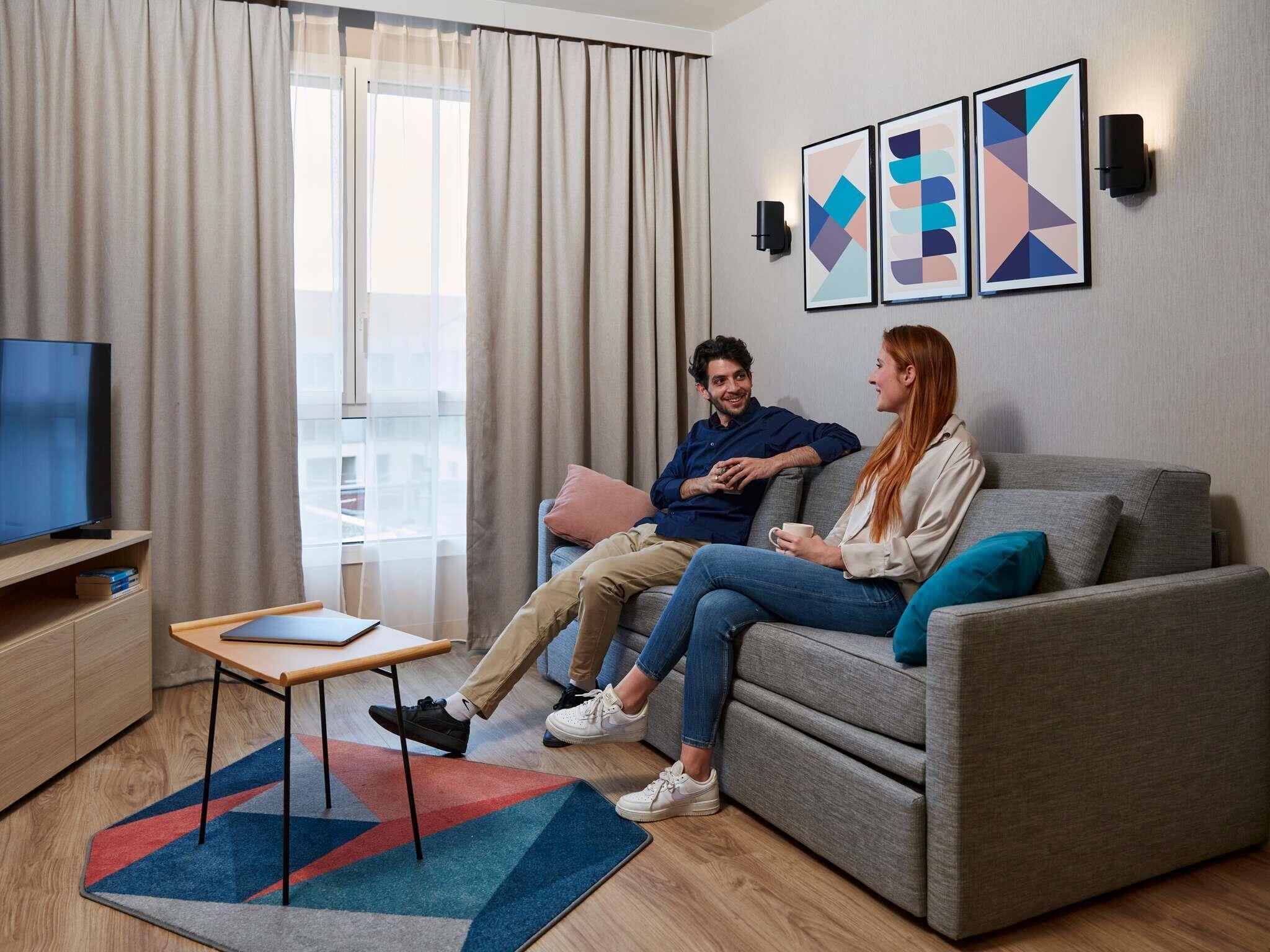 Apartment, 1 Bedroom | In-room safe, laptop workspace, blackout drapes, soundproofing