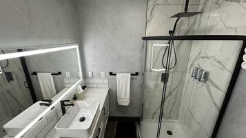 Shower, hair dryer, towels, soap