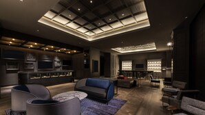 A modern interior with a central seating area, a kitchen, and a bar area. - Mercure Tokyo Haneda Airport (Tokyo)