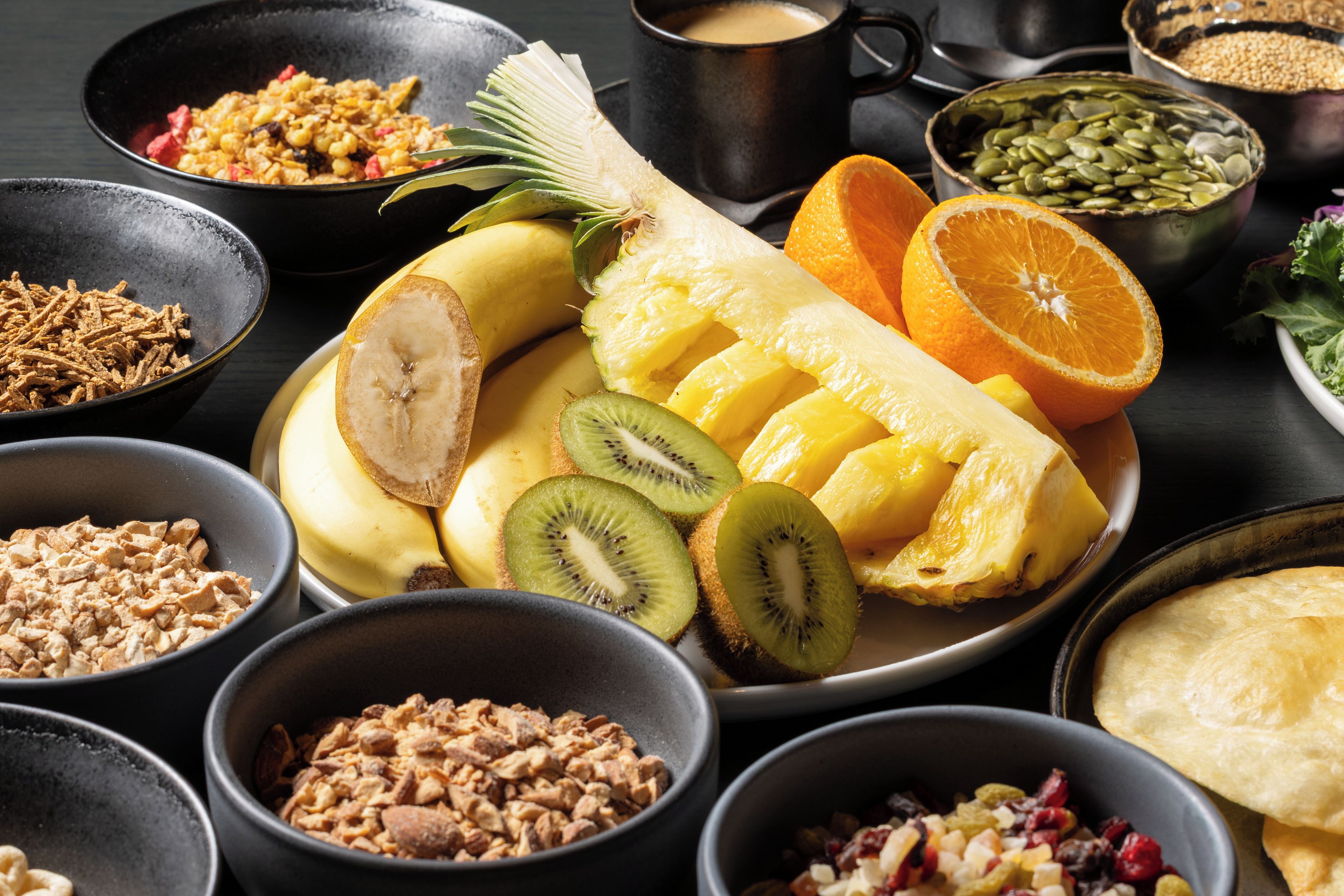 A variety of fruits and nuts arranged on a table.