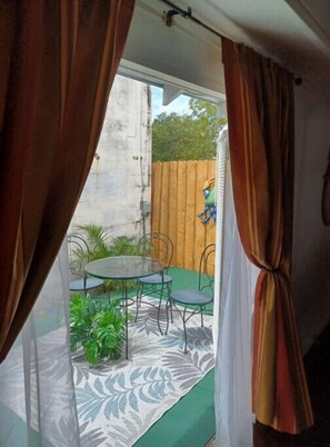 A room with a view of a patio area. - Lofty open space near hospitals (Clearwater)