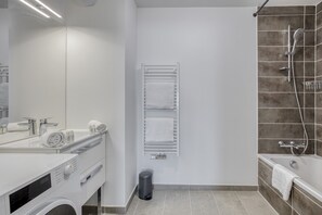 Bathtub, hair dryer, towels