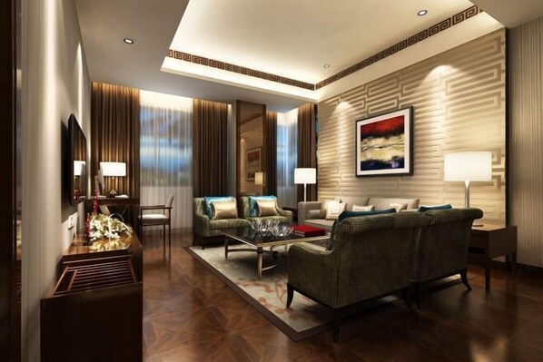 A modern hotel lobby with a sofa set, a coffee table, and a decorative lamp. - Manas County Hotel (Manas County)