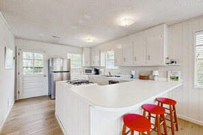 Fridge, microwave, oven, stovetop - Beach home with huge lawn, open deck, covered patio & grill (Edisto Beach)