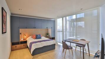 Desk, laptop workspace, blackout curtains, iron/ironing board