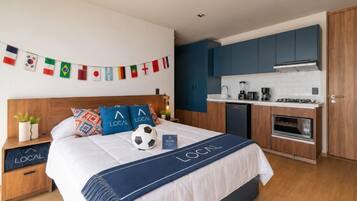 Standard room with Kitchenette | Desk, laptop workspace, blackout curtains, iron/ironing board