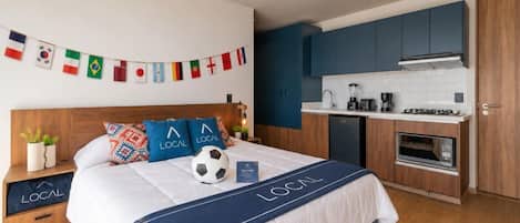 Standard room with Kitchenette | Desk, laptop workspace, blackout curtains, iron/ironing board