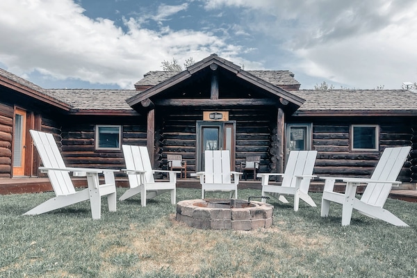 Courtyard with fire pit in the middle of the 3 main cabins