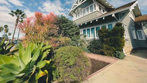 A two-story house with a gabled roof and a front porch.