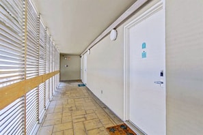 Guest rooms line the corridor, each with its own entrance and amenities.