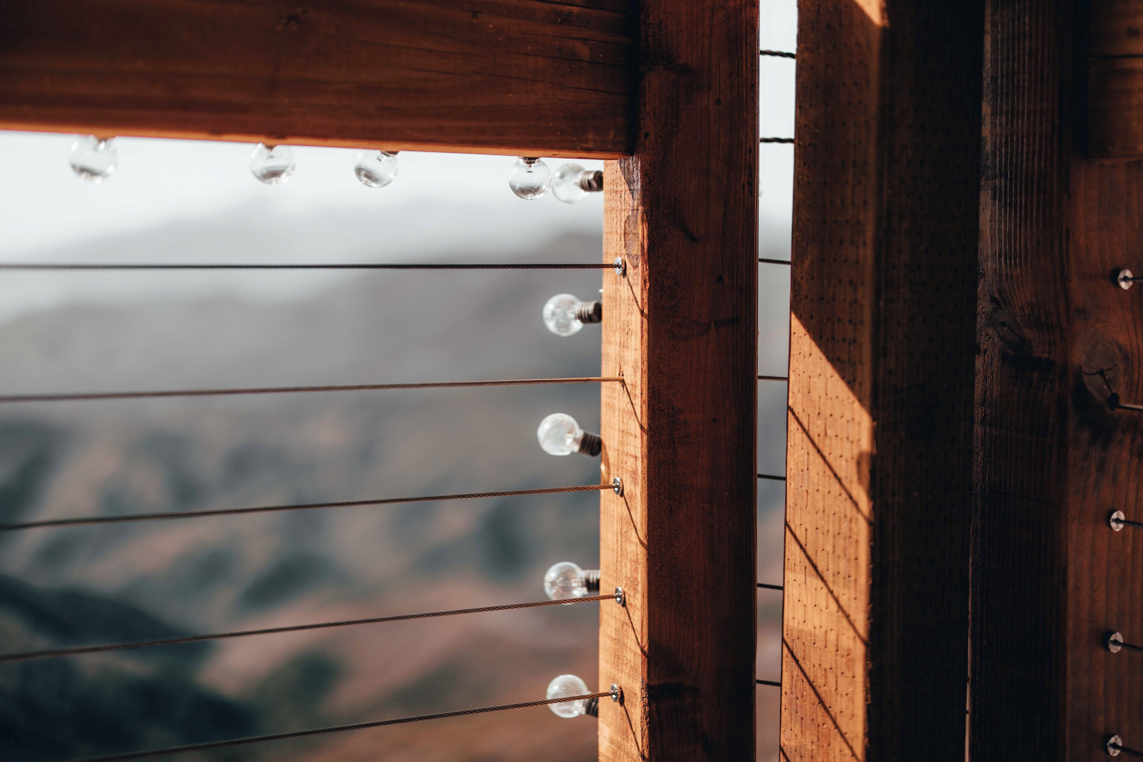 A wooden structure with multiple light bulbs.