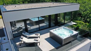 A modern rooftop with a hot tub, lounge chairs, and glass balustrades. - Luxury Villa Cloer, Jadranovo/Crikvenica (Jadranovo)