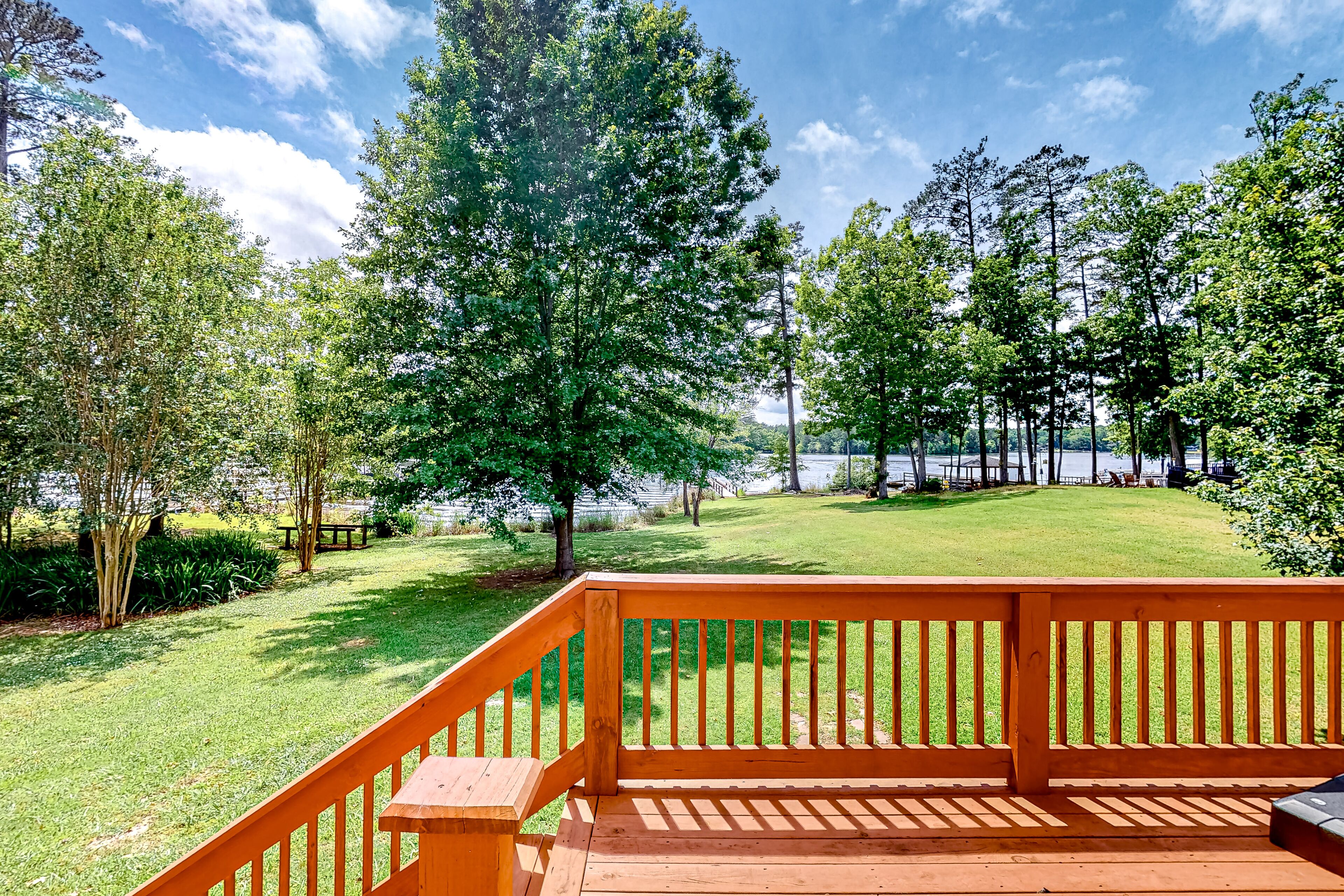 Waterfront home with private dock, boat ramp, large deck, grill, & W/D