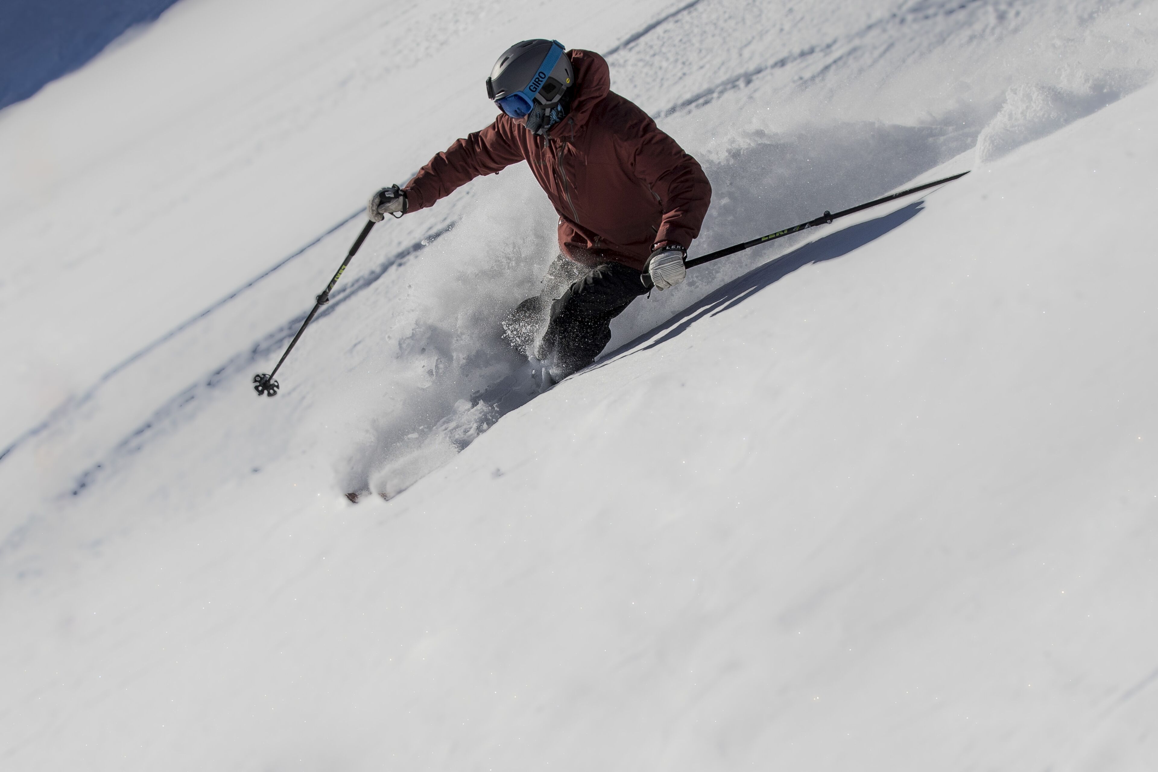A person skiing down a snowy slope.