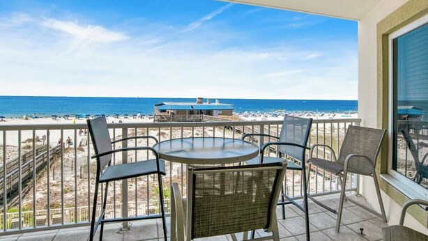 A balcony with a view of the beach and ocean. - Steps Away from the Beach, Food, and Entertainment (Gulf Shores)
