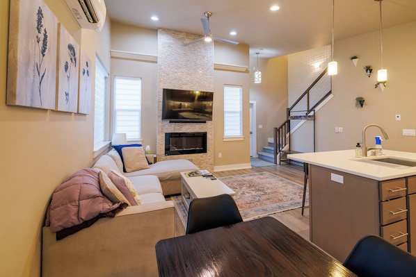Smart TV, fireplace, books, offices