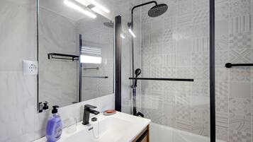 Bathtub, hair dryer, towels